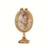 0c14fdf6-61ed-4e45-a8f0-d17541dd49ca.jpg A Beautifully Crafted Vintage-Style Oval Golden Photo Frame Ornament